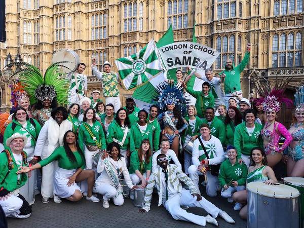 London School of Samba - photo of the drummers and dancers at a London Samba Gig